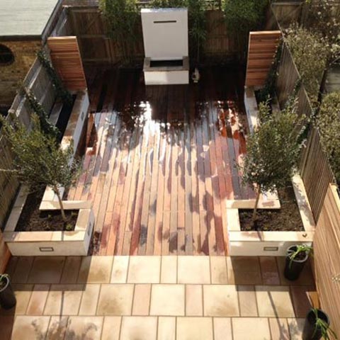 Hardwood decking and Indian Sandstone patio with Cedar fencing