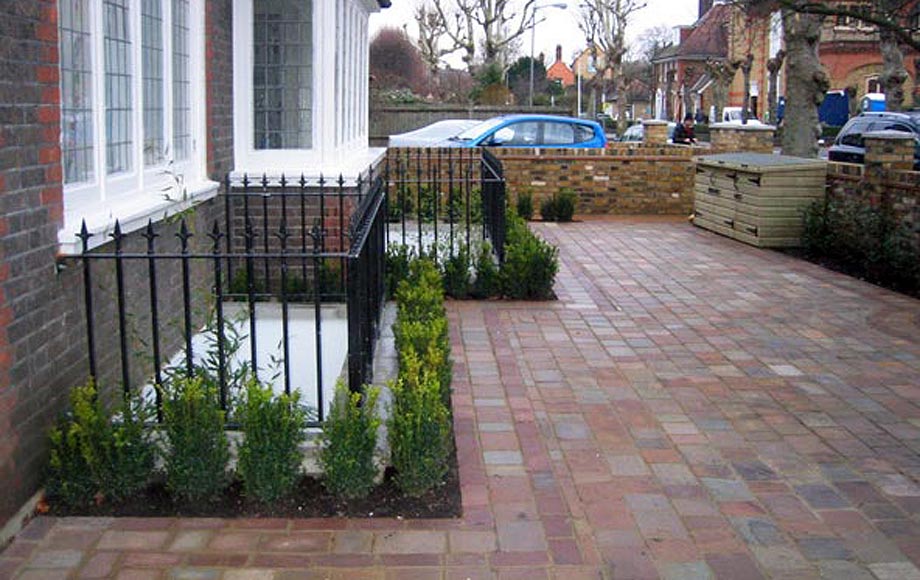 Sawn Sandstone with powder coated iron railings and intricate paving